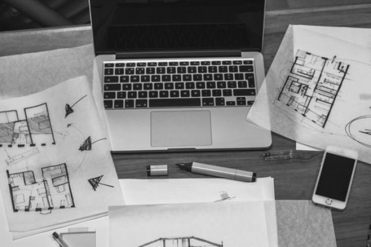 laptop and architectural plans