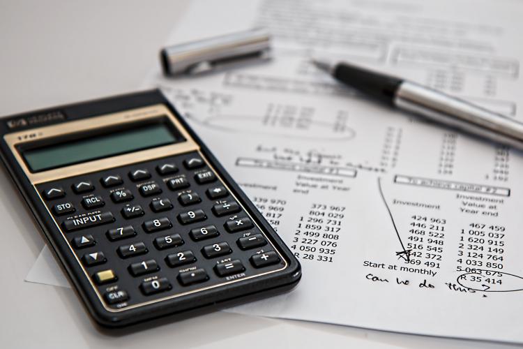 Calculator, pen, cost analysis