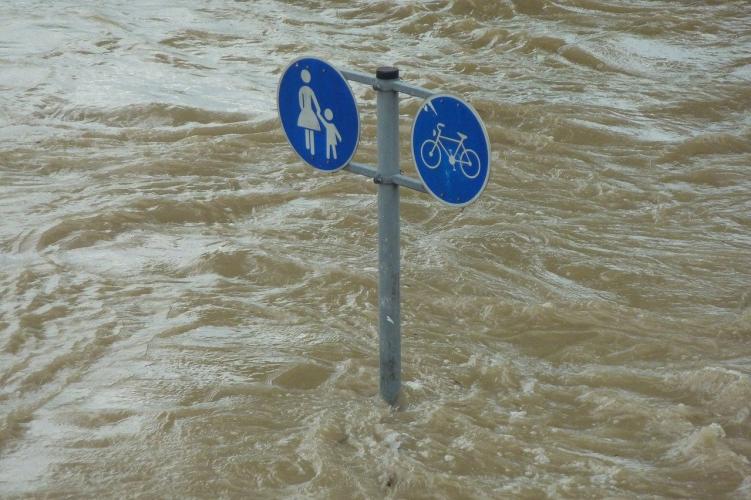 high water engulfing public signpost