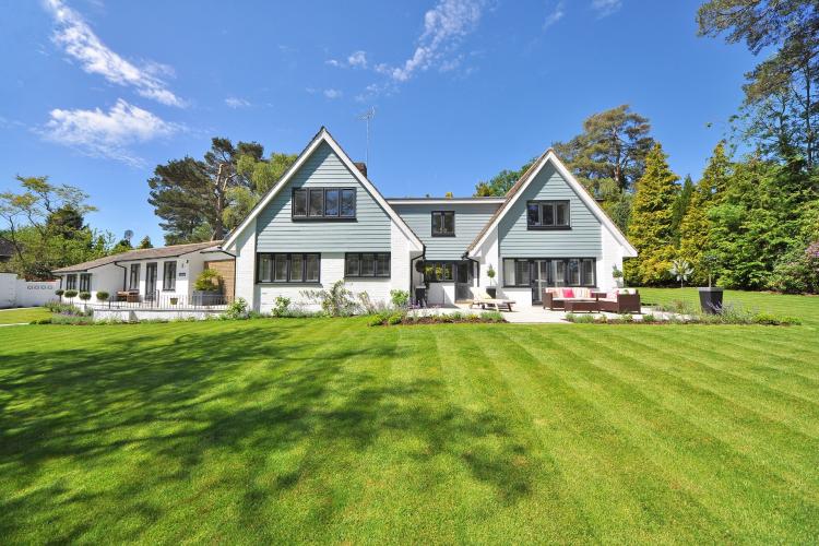 white home with a green lawn