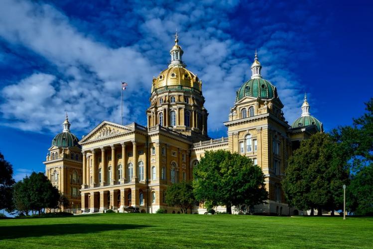 External view of the iowa state capital in front of a blue sky